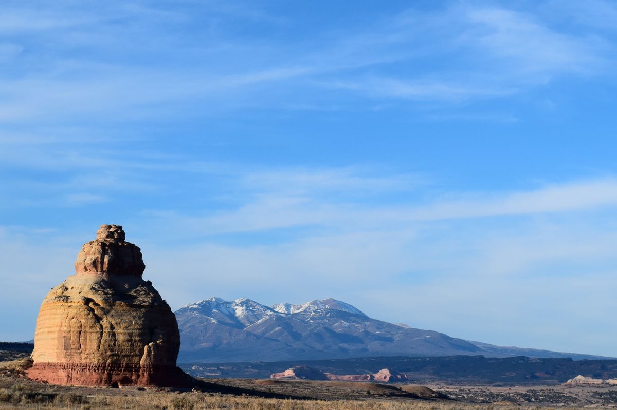 Red sandstone spire of Church Rock against a desert sky